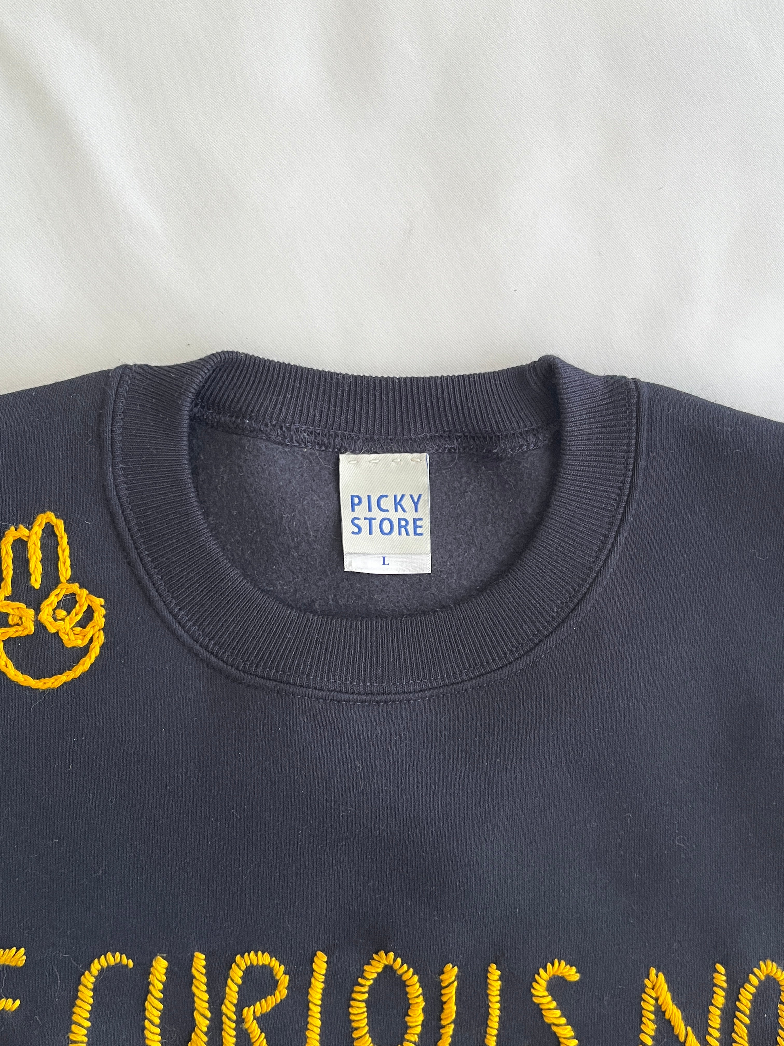 スウェット　"BE CURIOUS" embroidery